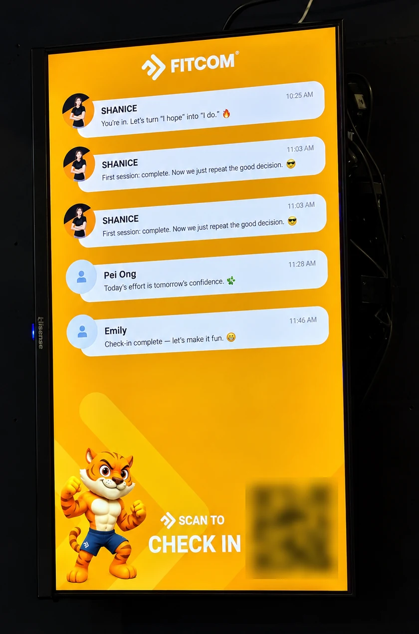 Check-in screen at the gym: members scan the QR and get a welcome message